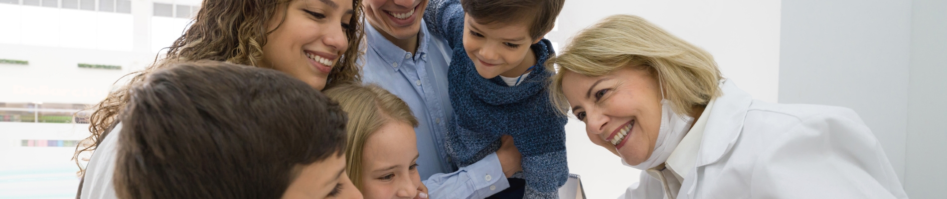 A family being talked to by a doctor