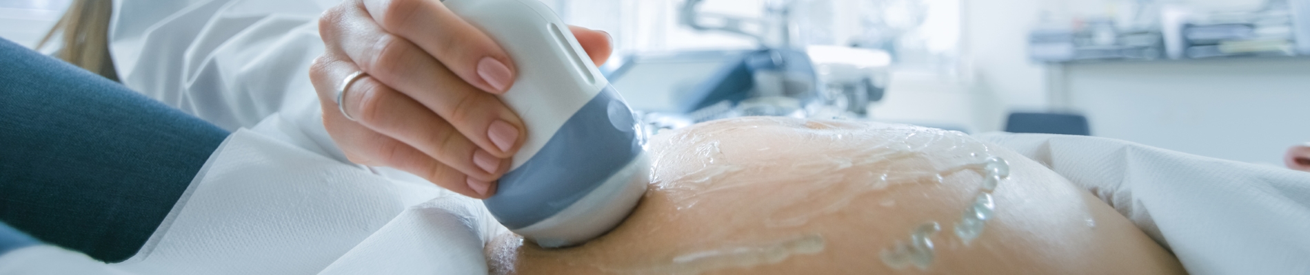 A pregnant woman getting a sonograph